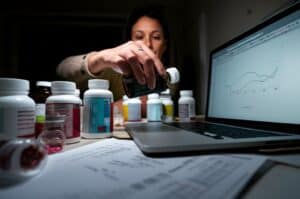 A container with food in it and the words "components of a healthy cooking system".